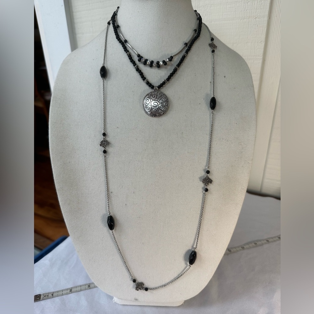 Three black and silvertone vibe necklaces